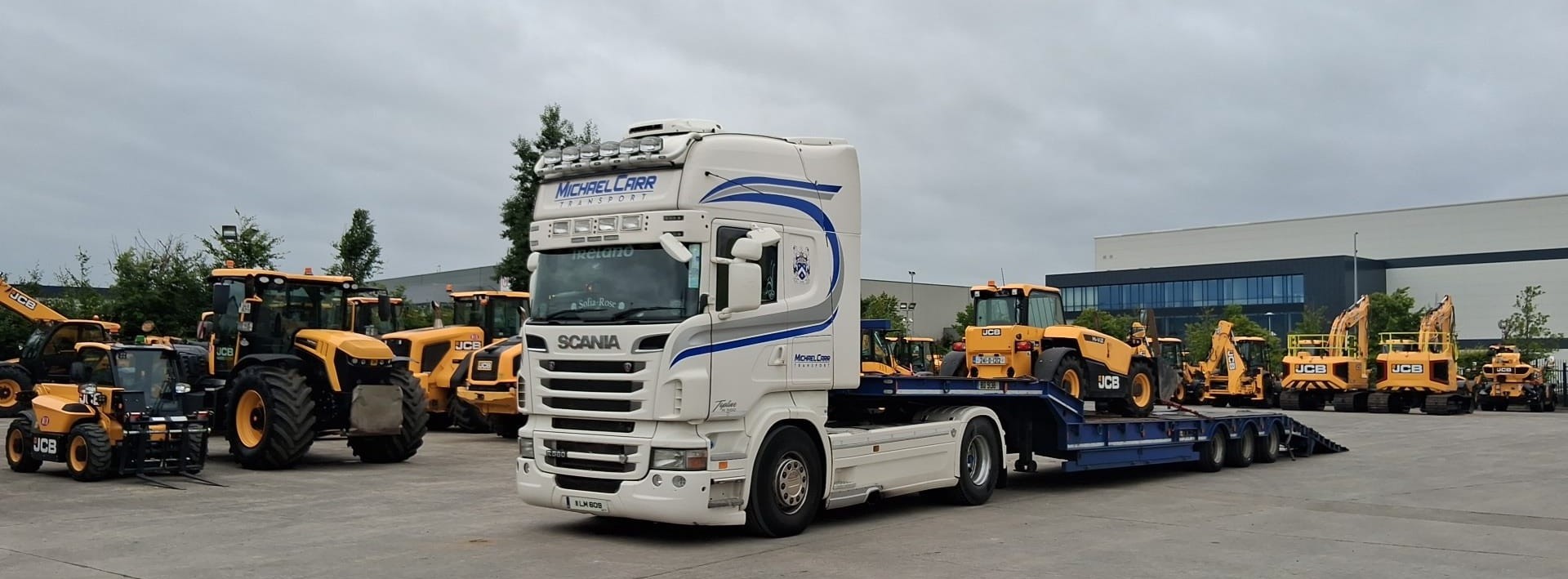 Michael Carr Transport low loader truck carrying machinery in Ireland